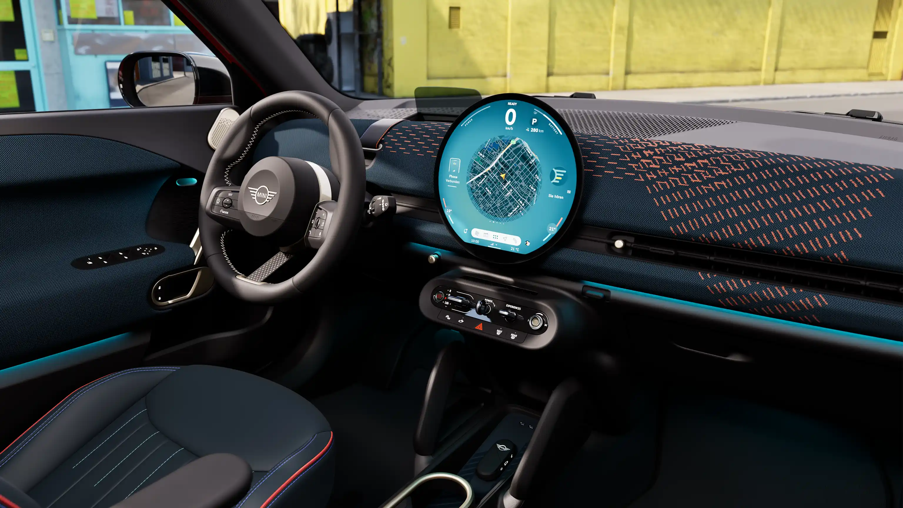 Video showcasing the interior of an all-electric MINI Aceman in detail. The camera pans through the interior and shows the blue upholstery