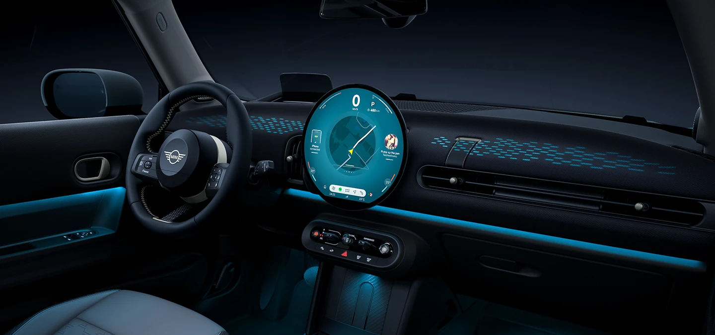 View of the interior of the MINI Cooper with ambient light in blue.