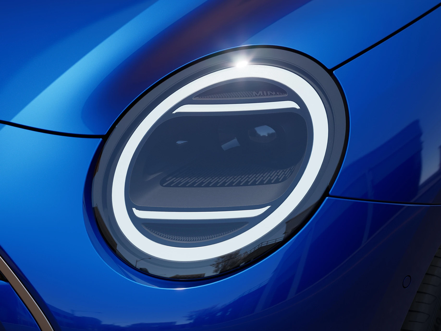 Close view of the all-electric MINI Cooper headlights with Exclusive Trim.