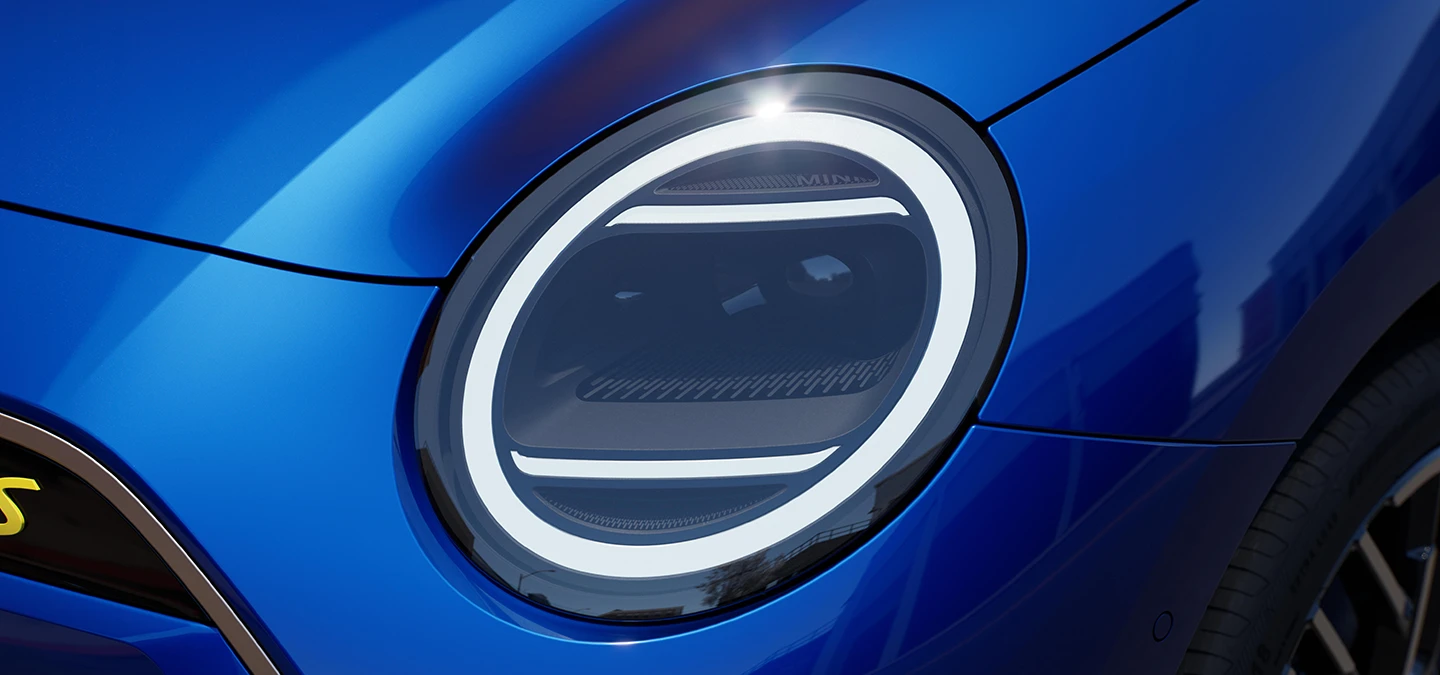 Close view of the all-electric MINI Cooper headlights with Exclusive Trim.