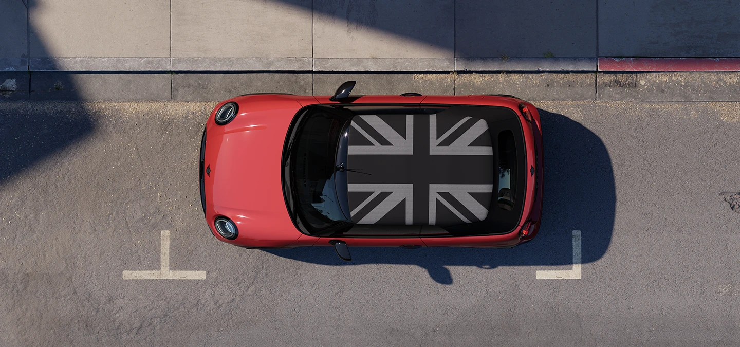 Top view of the MINI Cooper Convertible in Chili Red and MINI Yours Roof on a street.