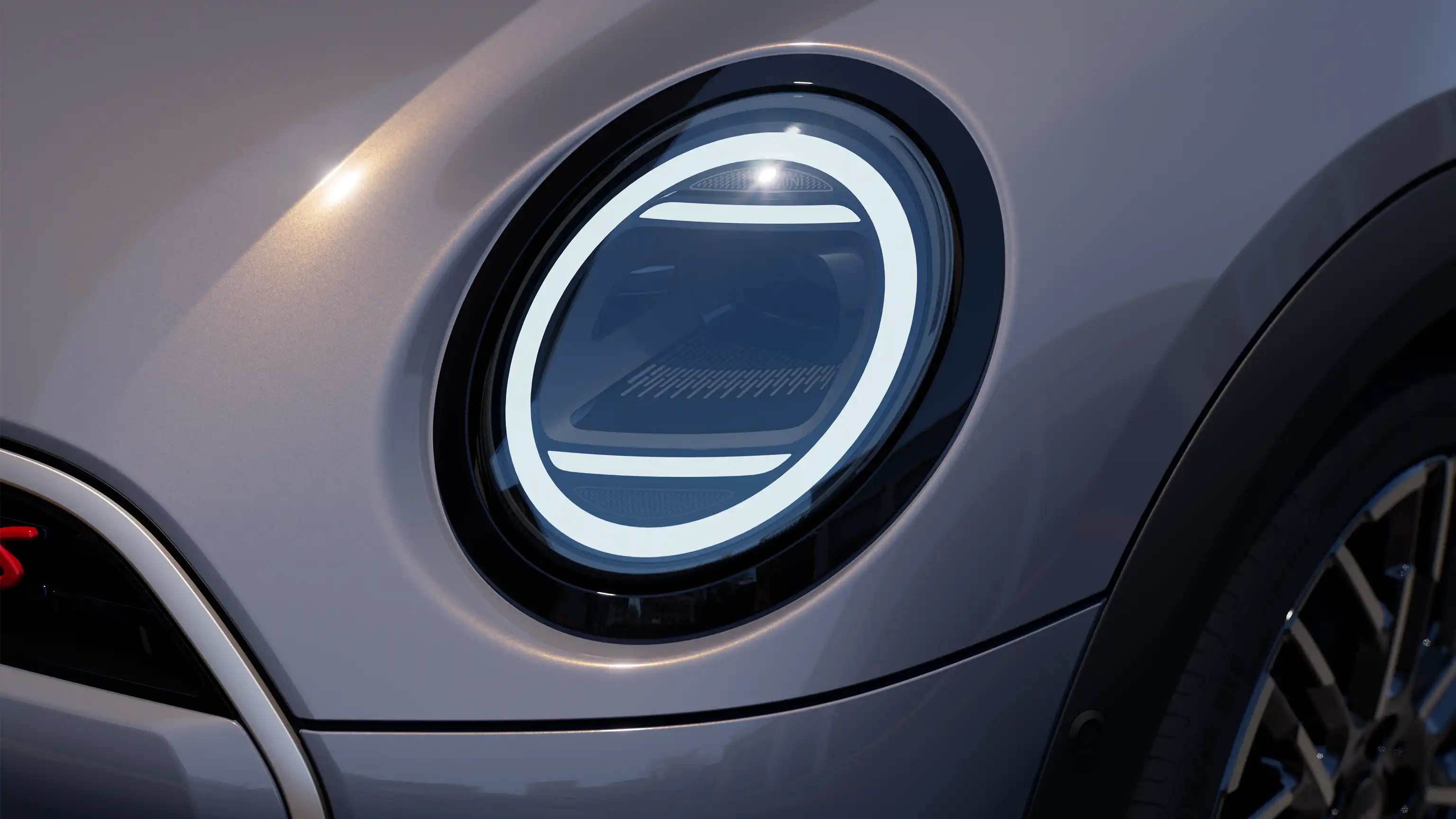 Detail view of the MINI Cooper Convertible with LED headlights on