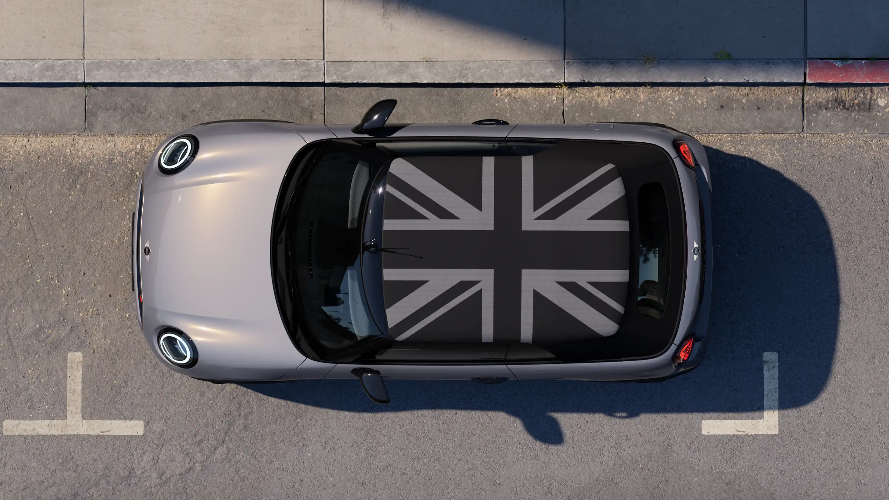 Top view of the MINI Cooper Convertible in Copper Grey with MINI Yours roof parked on street