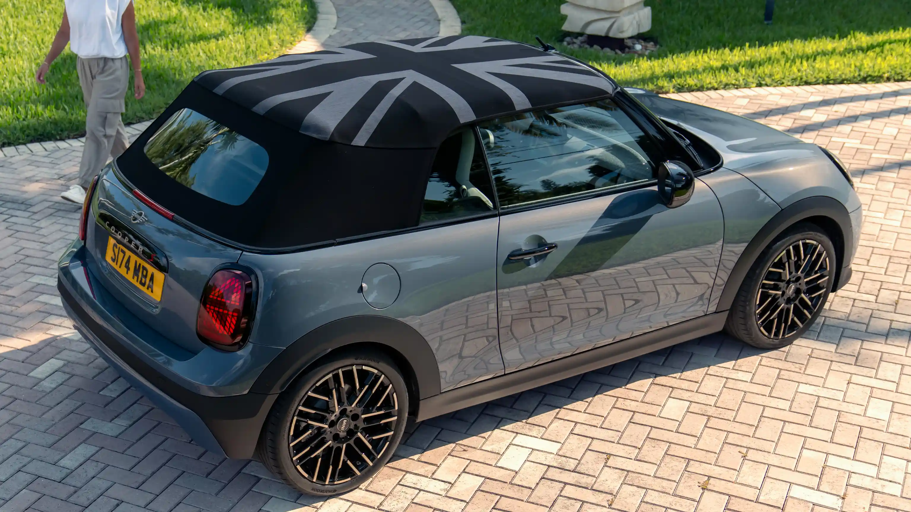 Top side view of the MINI Cooper Convertible in Copper Grey and MINI Yours roof