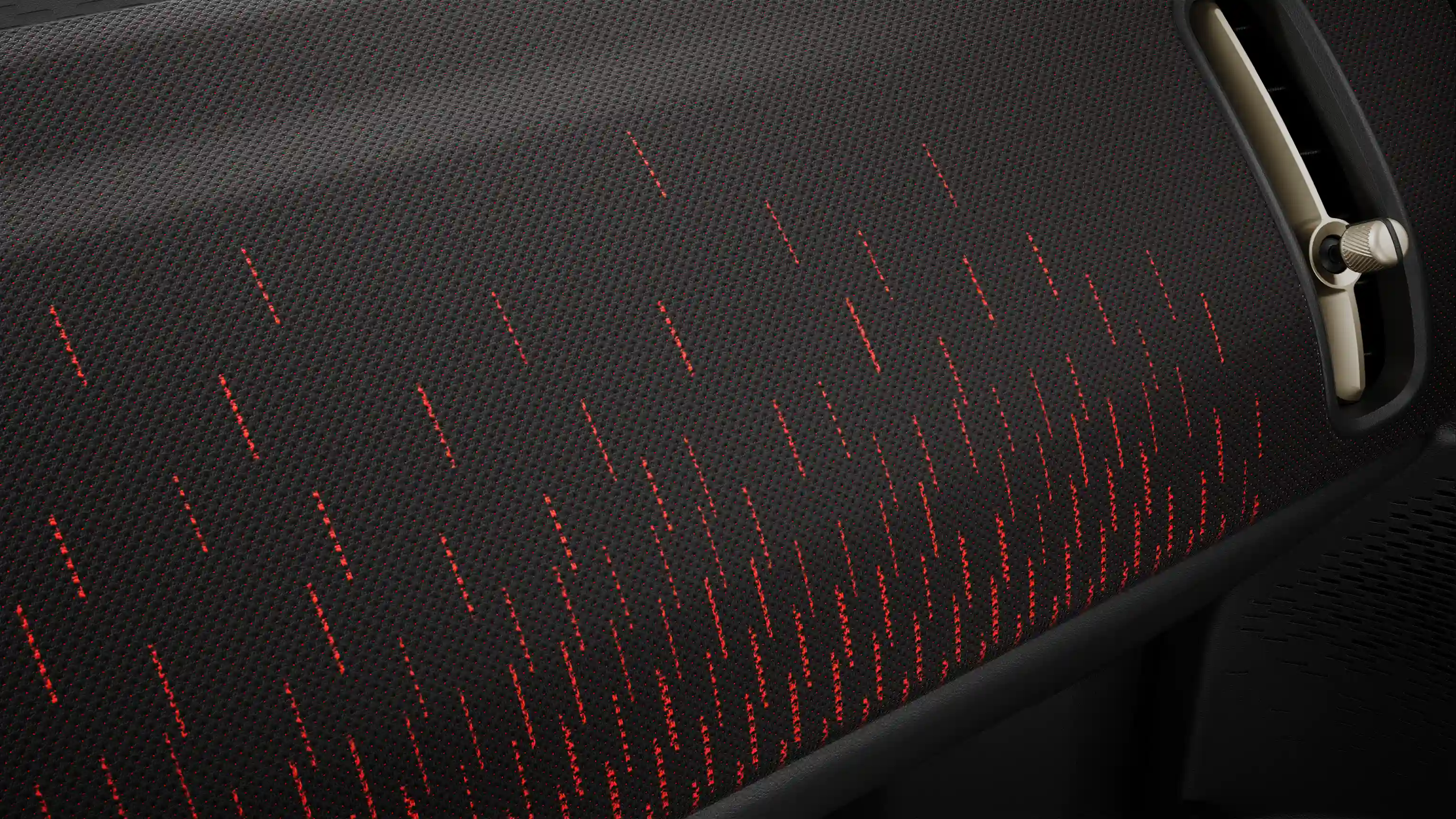 View of the all-electric MINI Countryman Sport Style dashboard in red and black