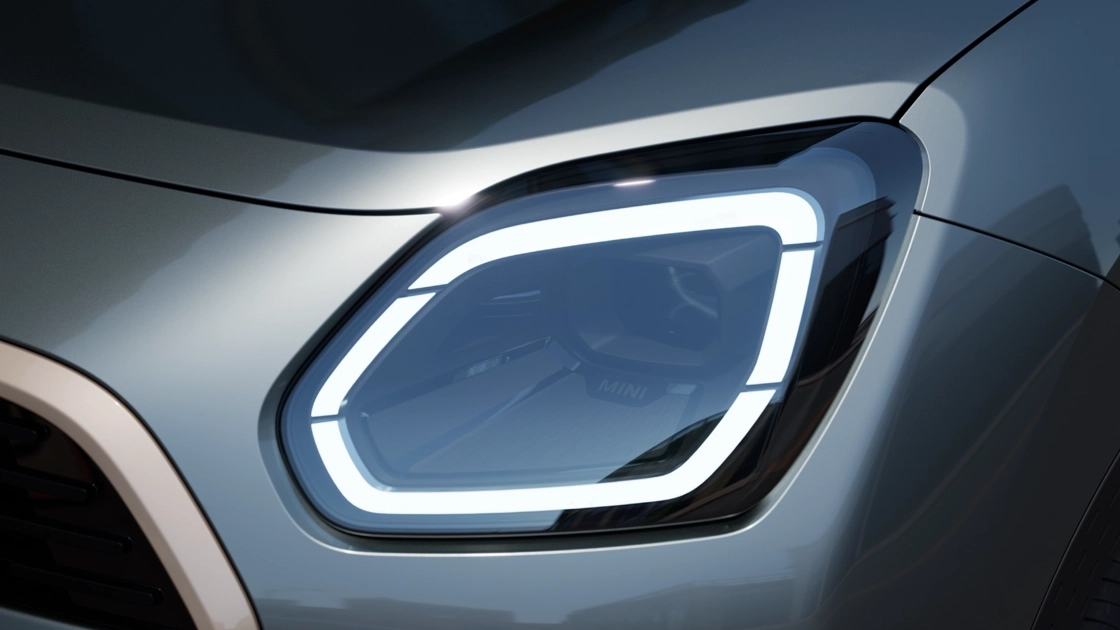 Detail view of the MINI Countryman headlight with white light on