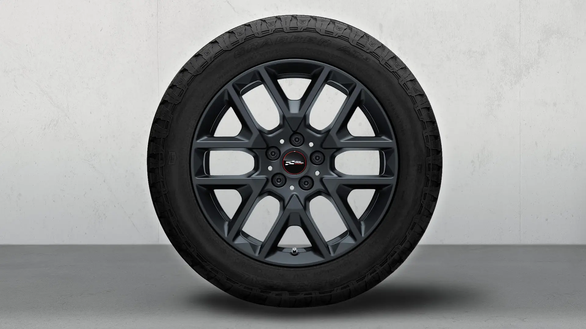 Close-up of the 18" JCW Y-Spoke style 945 Light Alloy Wheel in Frozen Midnight Grey.