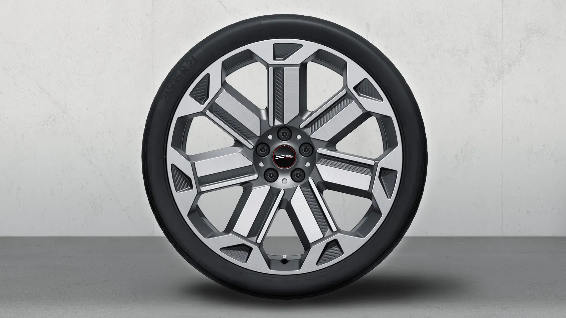 Close-up of 21" JCW Light Alloy Rallye Spoke style 950 summer complete wheel in Frozen Gunmetal Grey and gloss-lathed.