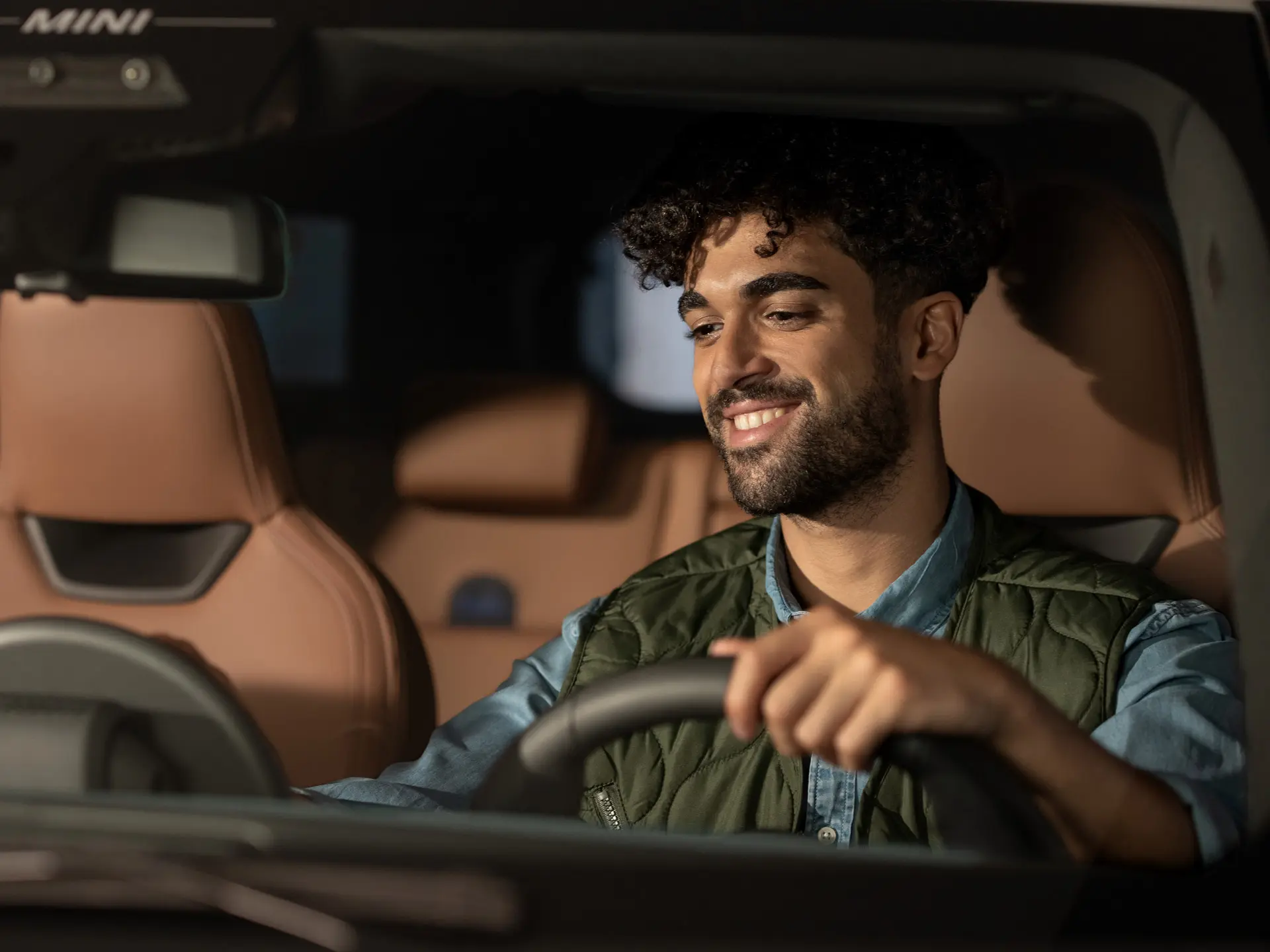 Man sitting in a MINI contacting Roadside Assistance