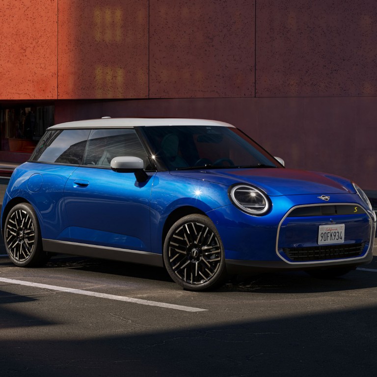MINI Cooper 3-door driving down the street