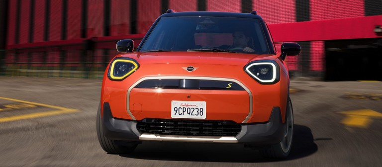 all-electric MINI Aceman driving down the street