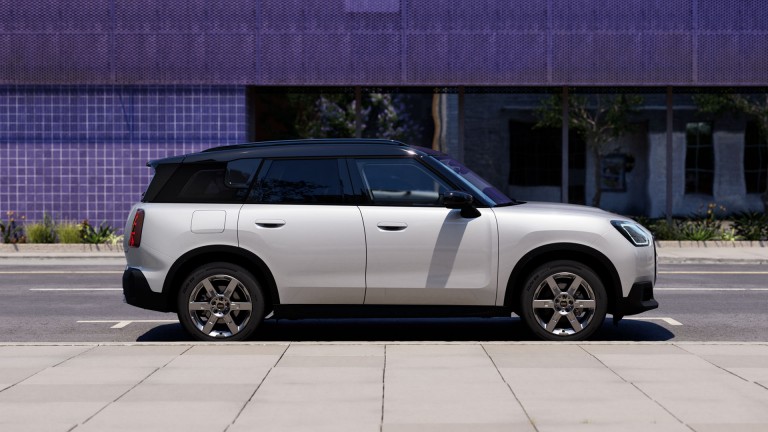 MINI Countryman parked off-road near hills