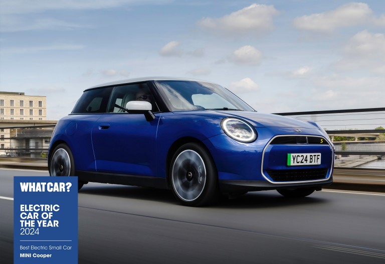 all-electric MINI Cooper driving down the road 
