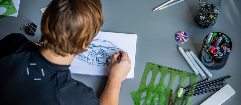 A bird’s eye view: MINI Automotive Designer Josef Kuhlmann drawing a MINI.