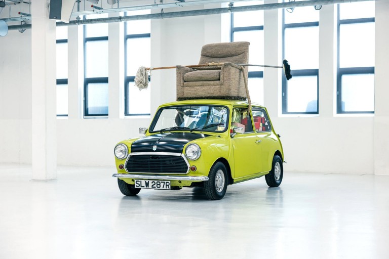A photo of the Mini 1000 „Mr. Bean” showing of the sofa on top of the car.