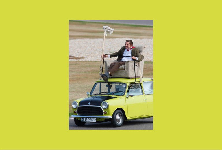 Rowan Atkinson as Mr. Bean on the Mini 1000 ''Mr. Bean'' at Goodwood Circuit in 2009.