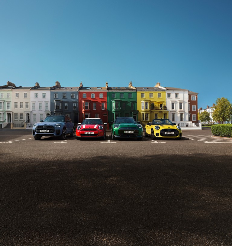 Electric MINI models displayed: Mini Cooper, Countryman, and Aceman, highlighting their unique designs.