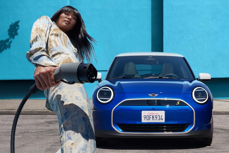 woman charging MINI Electric car