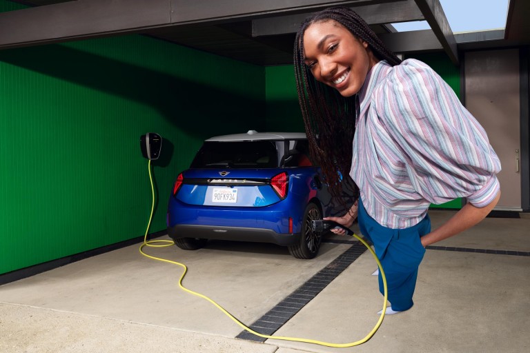 MINI Electric woman charging