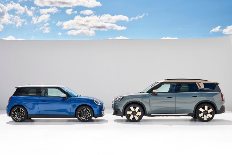 all-electric Cooper and all-electric Countryman facing each other