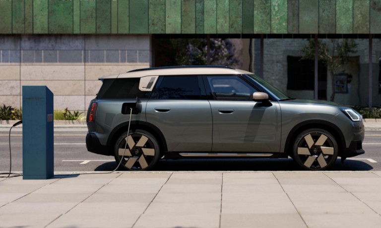 all-electric MINI Countryman charging on street